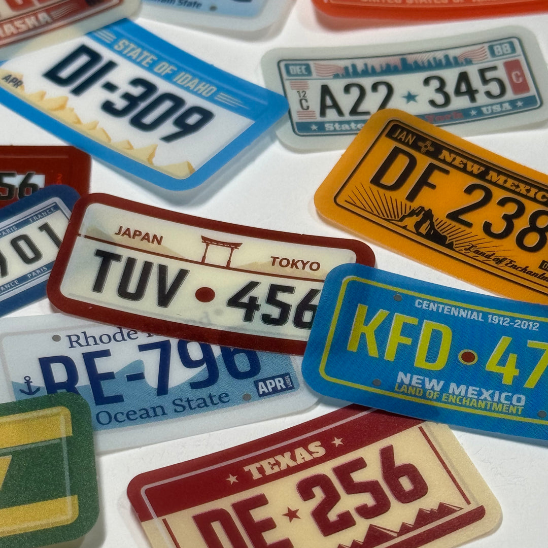 GLOBAL LICENSE PLATES Peelable Stickers  ~ 45 Pieces ~ Each Sticker is 38mm